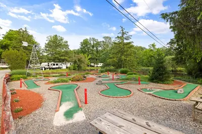a playground with a bunch of mini golf courses at Cozy Cabin2 Within Campground in Mifflinburg